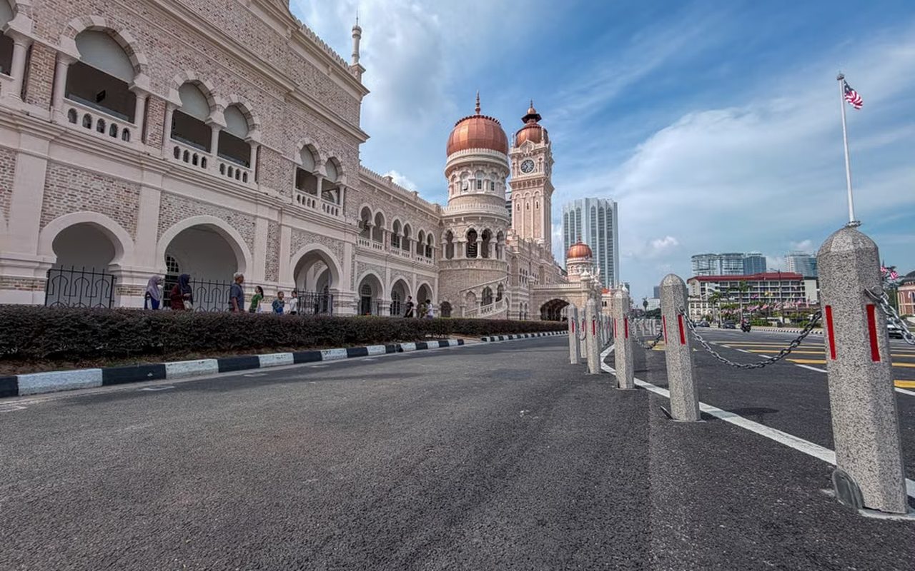 A near-empty road running past the Sultan Abdul Samad Building in Kuala Lumpur